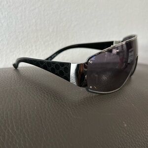 Gucci Sunglasses silver frame and black Gucci logo on arms
